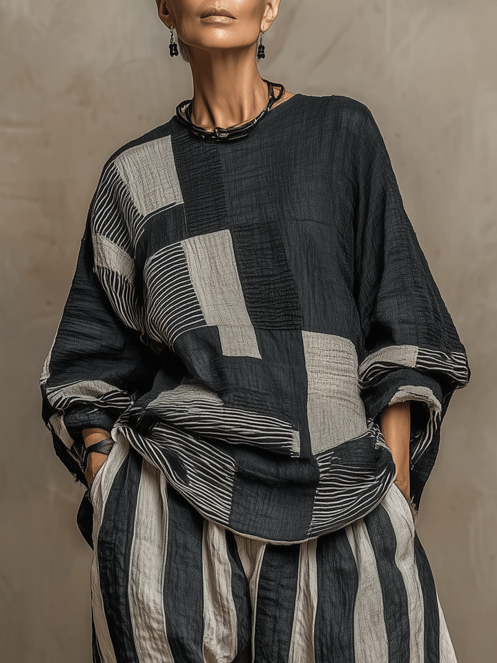 Versatile women's casual two-piece set featuring a colour-block top and comfortable striped wide-leg trousers.