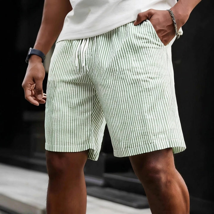 Relaxed fit men's striped shorts. Comfortable drawstring waist design for casual summer style.