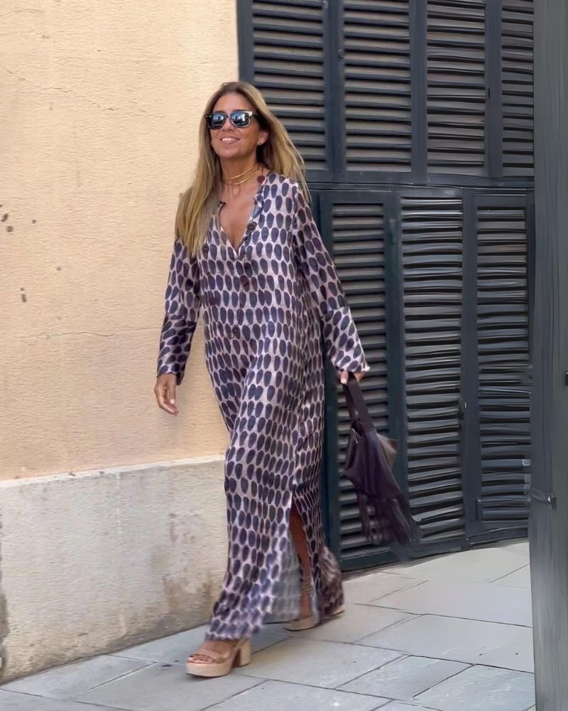 Elegant purple flowy summer maxi dress for women, comfortable & versatile for casual or dressy occasions.
