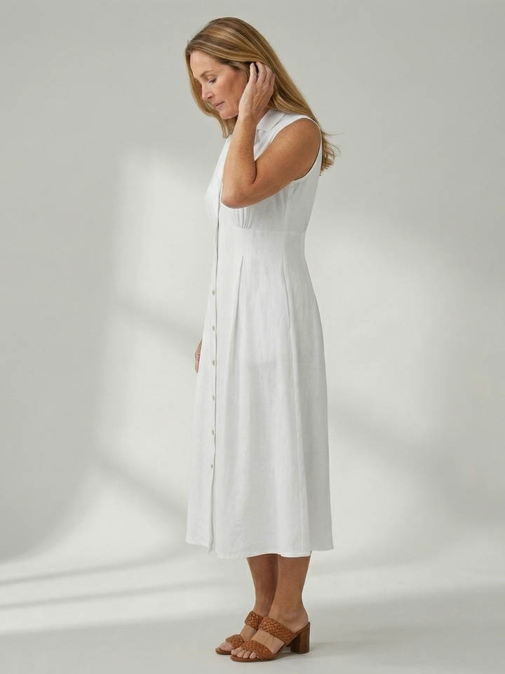 Sleeveless women's midi dress, elegant stack button detail, comfortable for all-day wear.