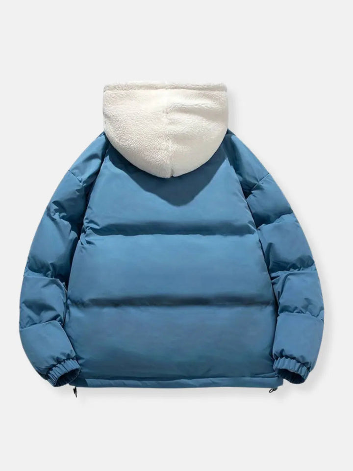 Women's designer puffer jacket, a stylish winter coat with a plush hood for a luxurious feel.