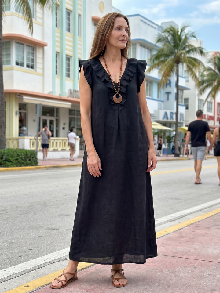 Comfortable and elegant women's midi dress, sleeveless, with ruffle trim and practical pockets.