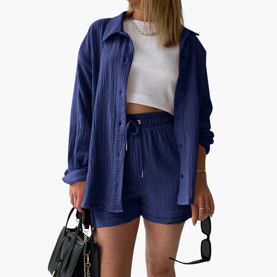 Solid color women's three-piece summer outfit: stylish button shirt, crop top & high-waist shorts. Coordinated.