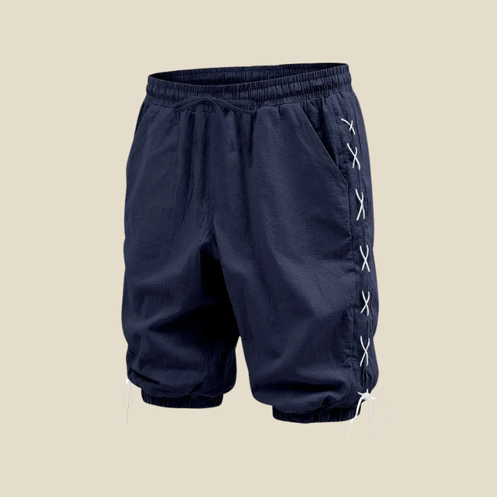 Comfortable men's relaxed fit shorts with drawstring waist & lace-up details, great for summer casual style.