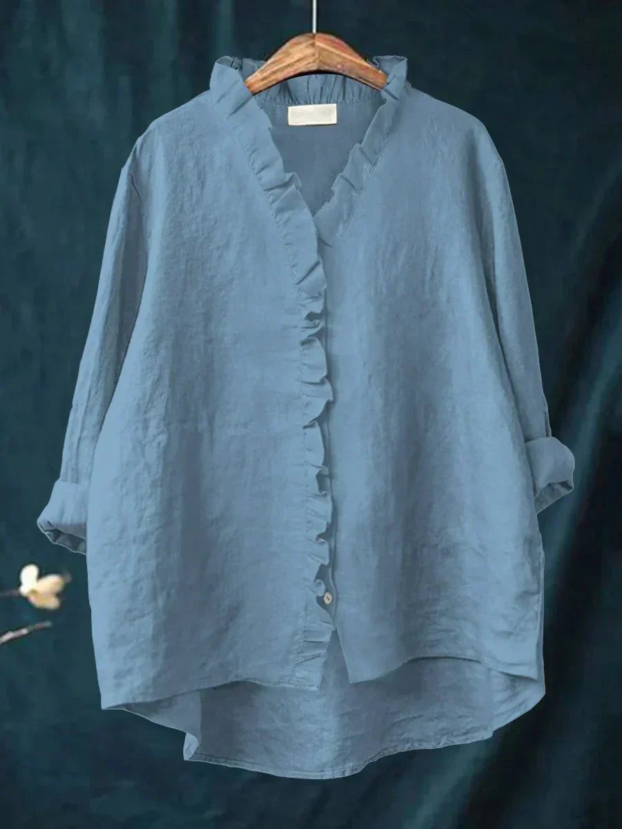 Women's V-neck blouse featuring ruffled details & long sleeves. A chic, comfortable casual top.