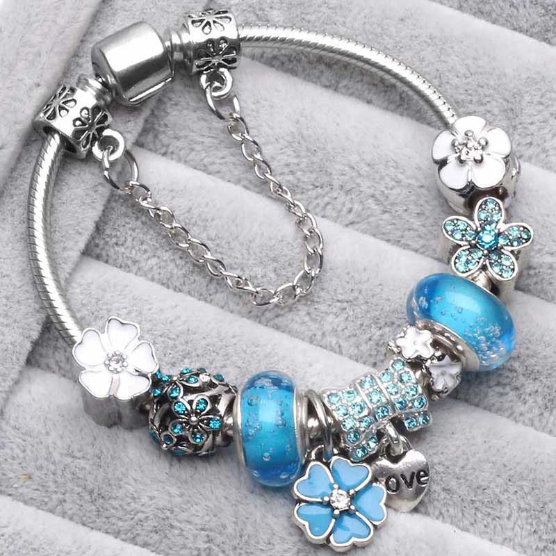 Delicate peach blossom charm bracelet for women, elegant floral jewelry and fashion accessory gift.