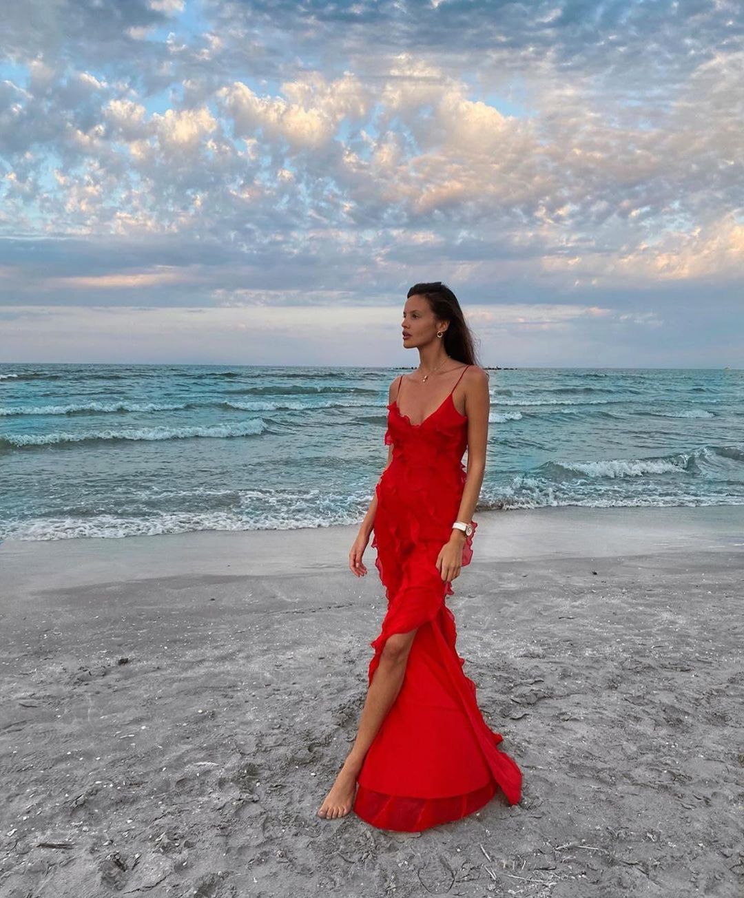 Women's elegant ruffled maxi dress, a stunning wedding guest outfit for summer or formal.