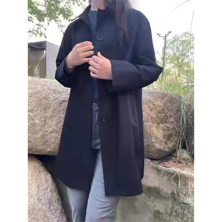 Timeless women's outerwear: a classic trench coat with a flattering tied waist for all seasons.