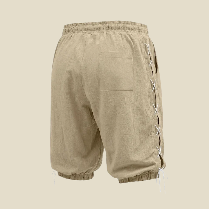 Stylish men's knee-length shorts with a relaxed fit and lace-up sides, perfect for casual streetwear.