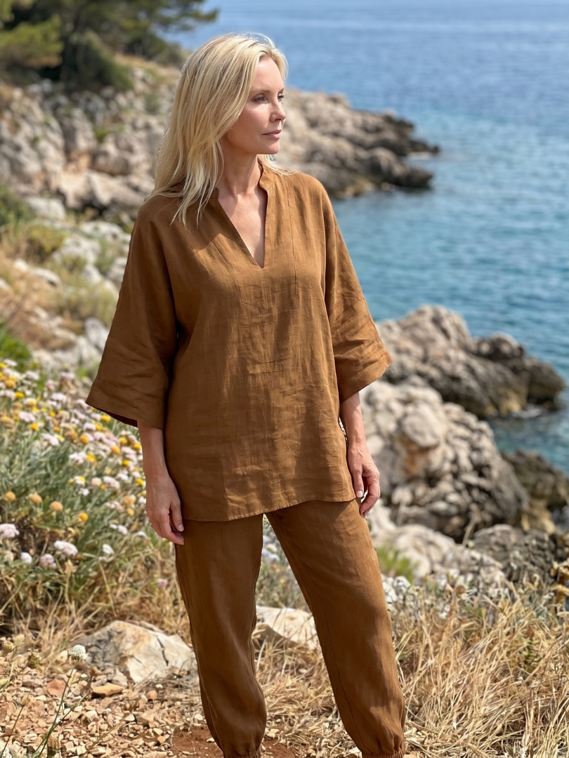 Stylish women's loungewear set featuring a relaxed V-neck tunic & comfortable gathered trousers.