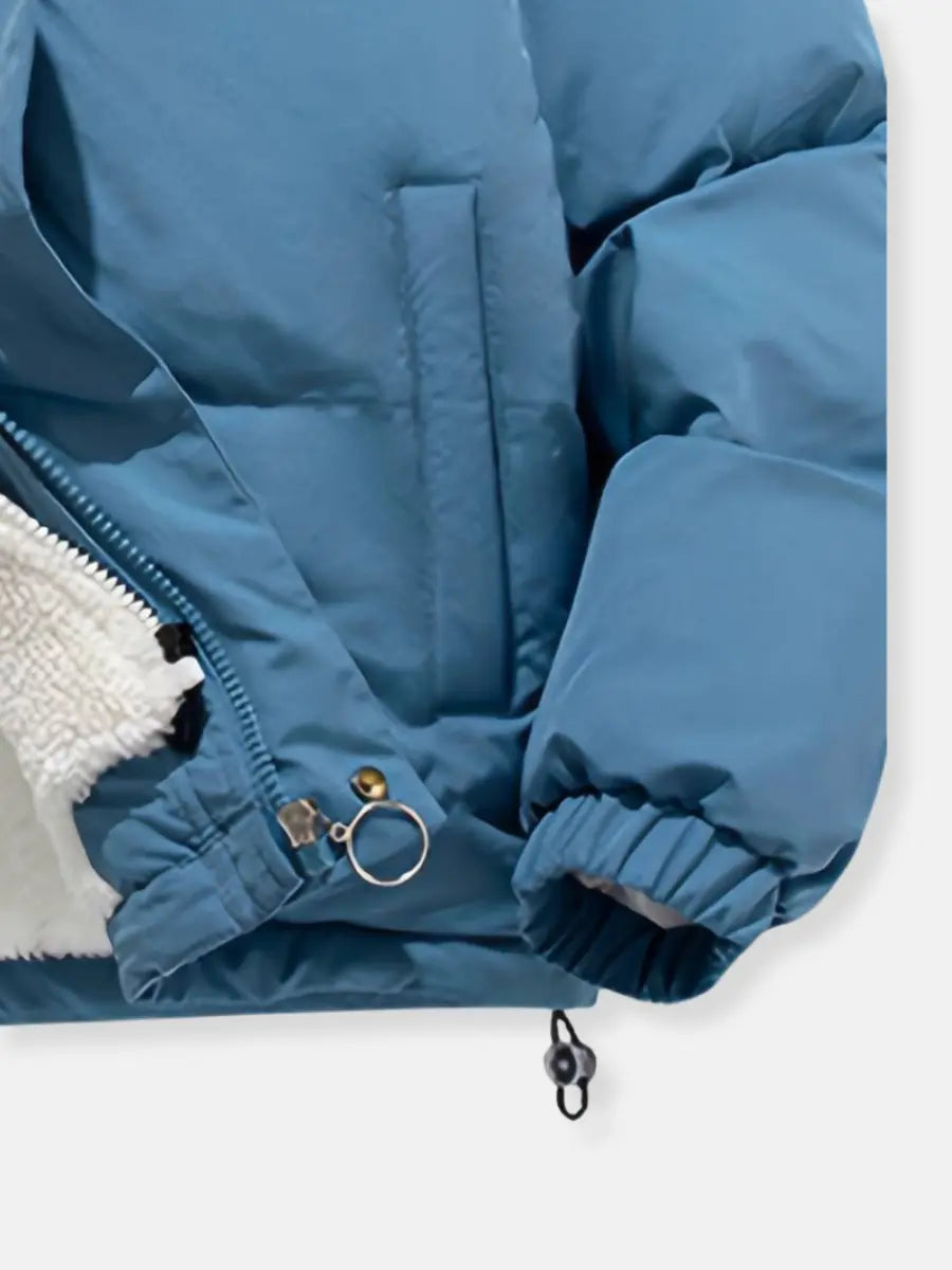 Casual women's black puffer coat with a cozy plush hood, essential warm outerwear for winter.
