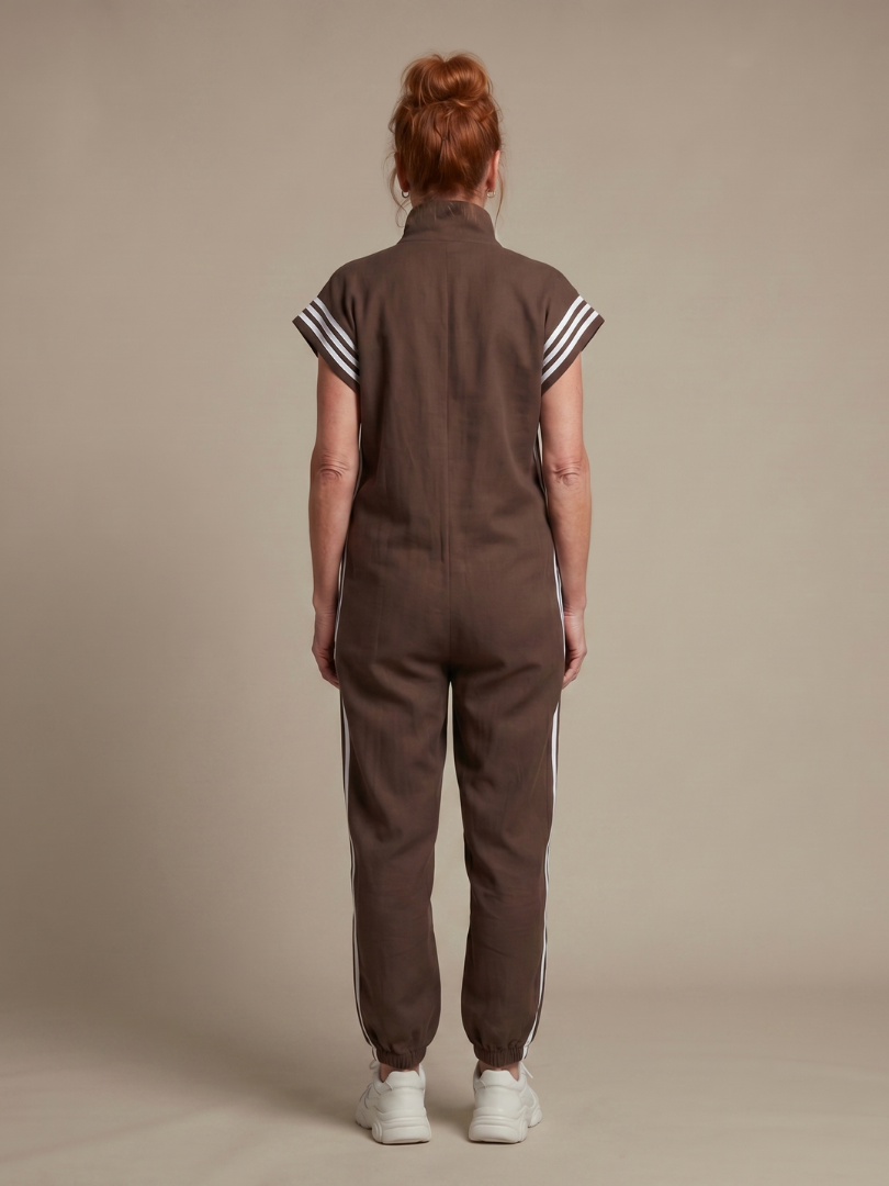 Elegant women's day to night jumpsuit, zip front, high neckline, and striking stripe panels.
