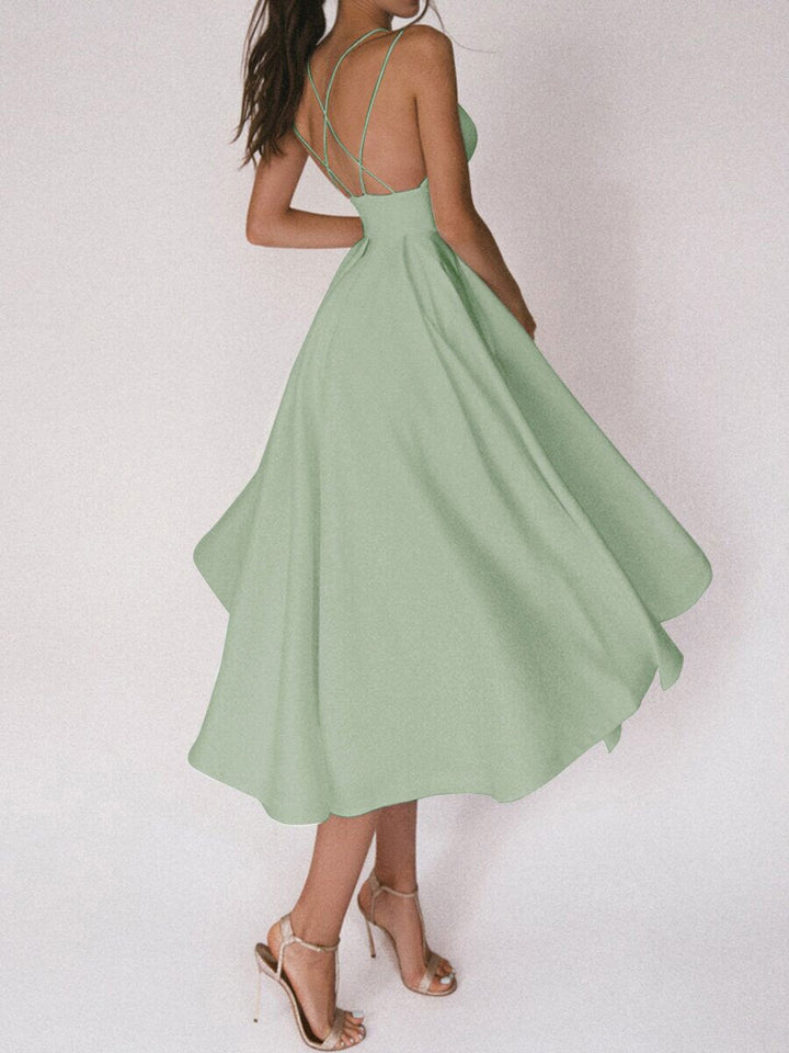 Women's sleeveless V-neck midi dress, elegant A-line cut with delicate spaghetti straps for evenings.