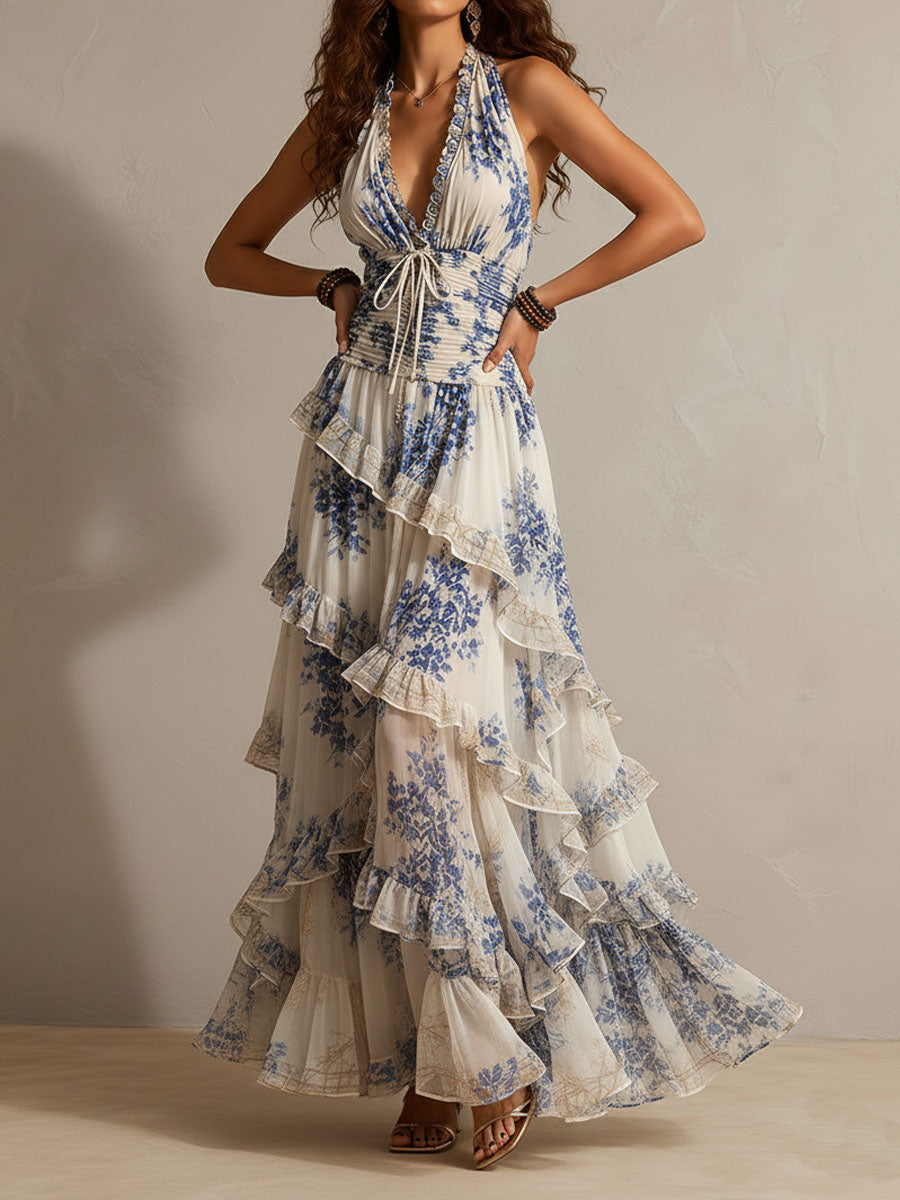 Elegant women's blue floral halter boho maxi dress, featuring tiered ruffles. Ideal vacation outfit or resort wear.