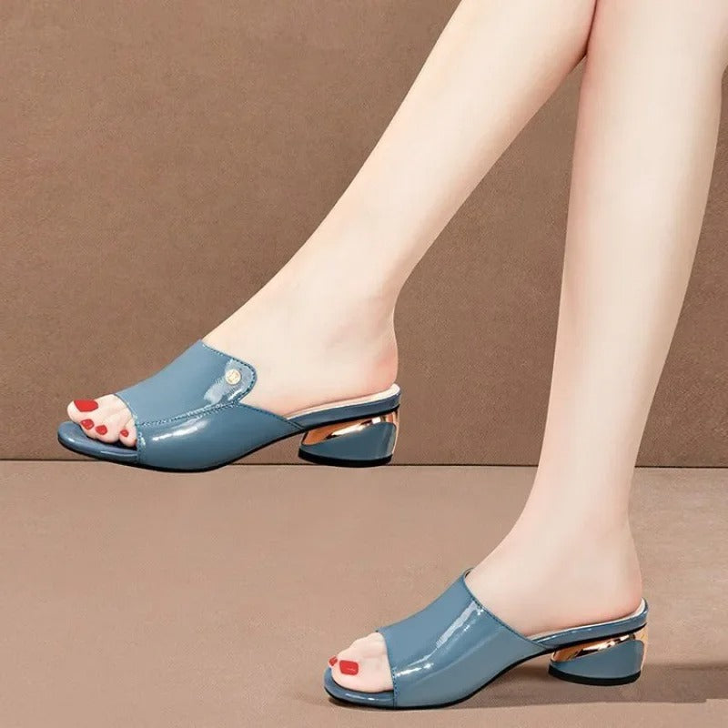 Women's elegant low-heel comfort sandals with a glossy finish, perfect for sophisticated summer fashion.