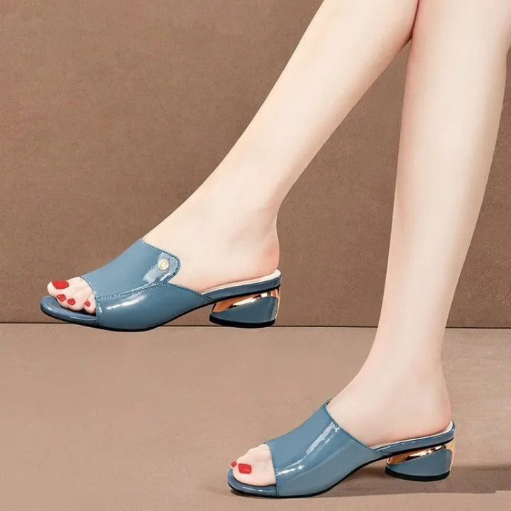Women's elegant low-heel comfort sandals with a glossy finish, perfect for sophisticated summer fashion.