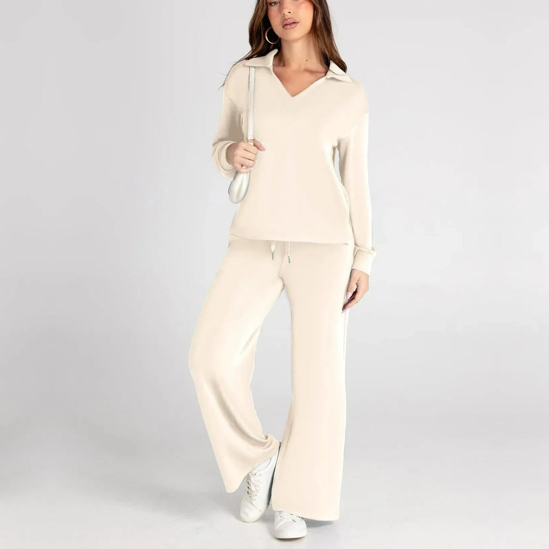 Elegant women's loungewear set. V-neck long sleeve top paired with wide leg trousers. Relaxed style.