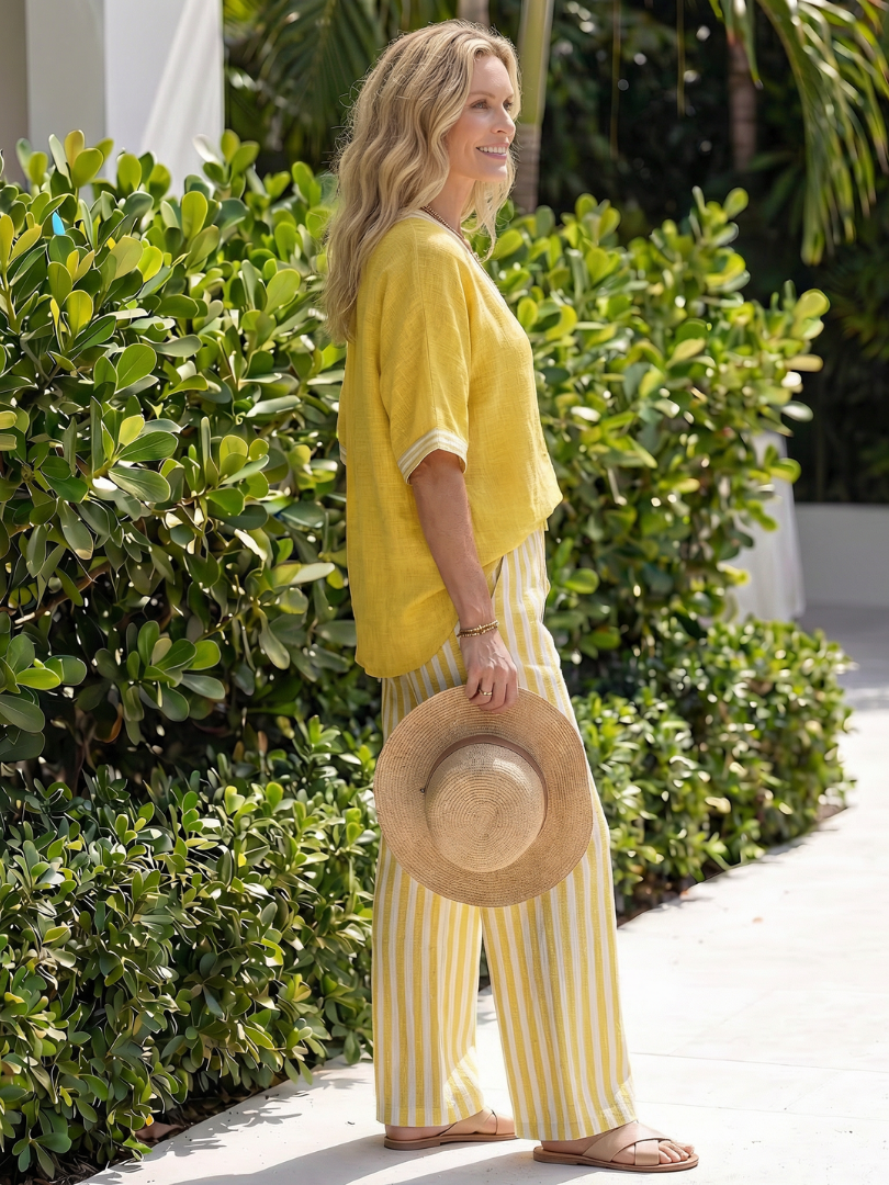 Women's fashionable tunic & trouser set, featuring a contrast V-neck and striped pattern.