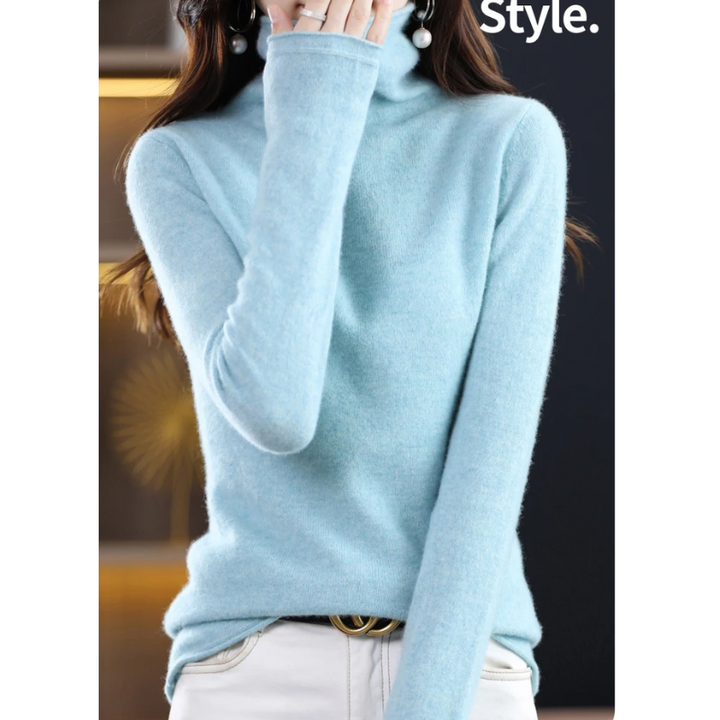 Soft women's pullover with roll neck. Stylish, elegant long sleeve top for autumn wear.