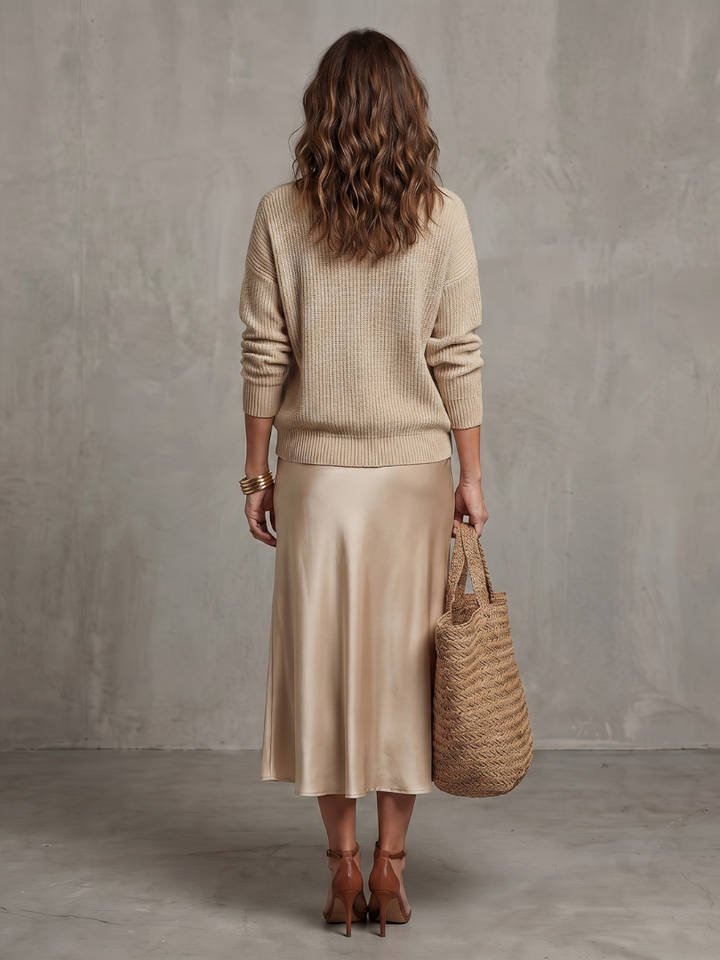 Women's two-piece long sleeve sweater & midi skirt. Elegant everyday wear, versatile fall fashion.
