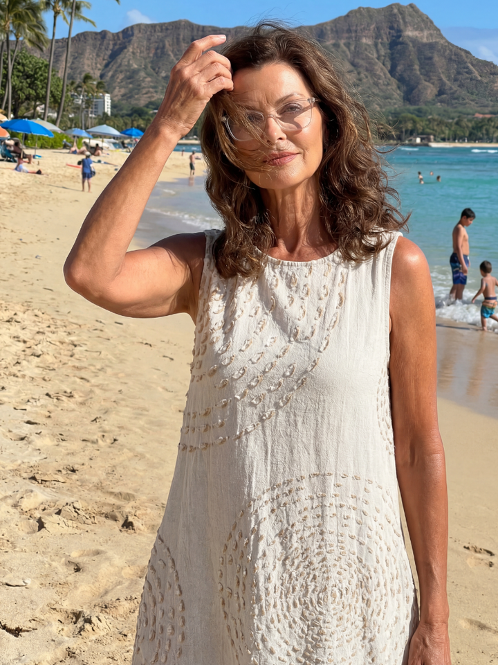 Women's relaxed fit white textured midi dress, perfect for casual summer days.