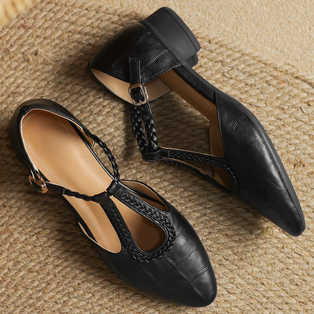 Women's black leather Mary Jane comfort flats, vintage T-strap design, low heel for classic everyday style.