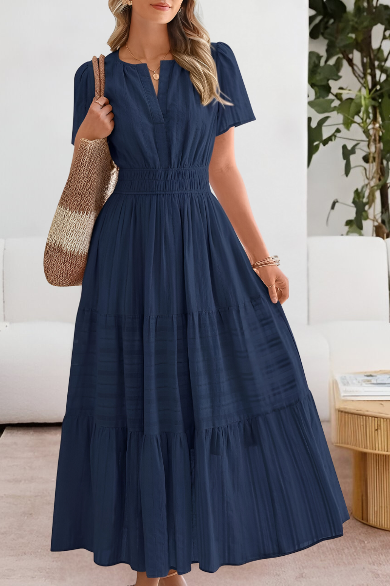 Comfortable women's short-sleeve smocked midi sundress, bohemian style, perfect for warm weather.