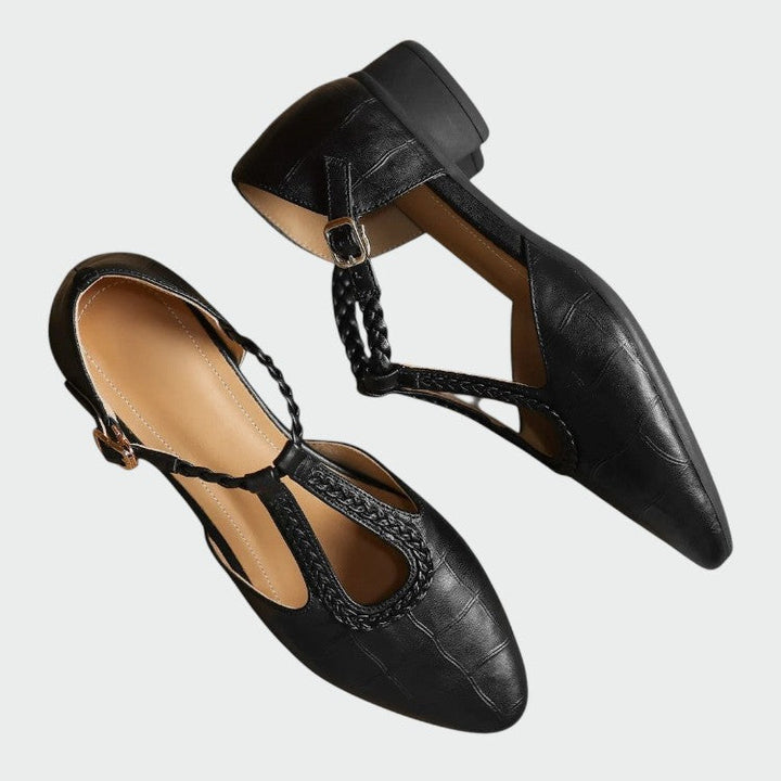 Stylish black pointed T-Bar Mary Jane shoes for women. Ideal elegant footwear for office workwear or evening events.