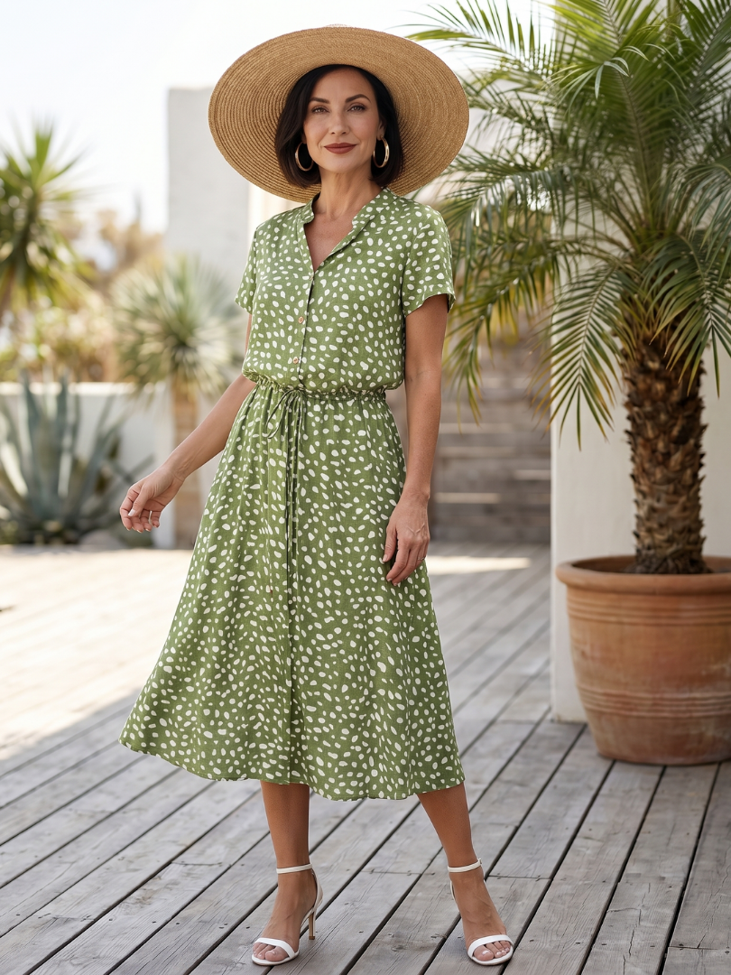 Women's printed midi dress with short sleeves, button front, and matching belt. Perfect for summer casual wear.