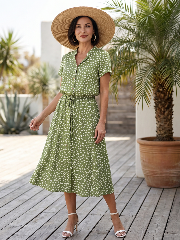 Women's printed midi dress with short sleeves, button front, and matching belt. Perfect for summer casual wear.