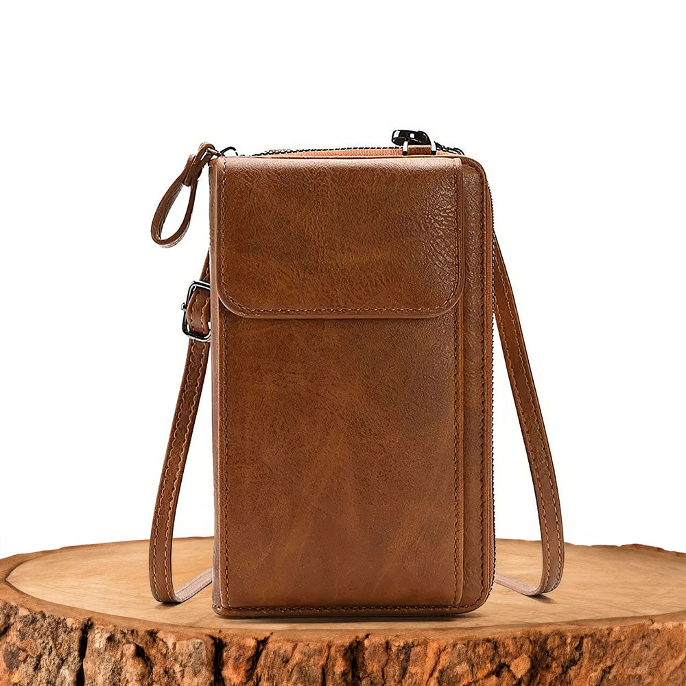 Elegant women's full-grain leather crossbody handbag with minimalist design, perfect for versatile daily use.