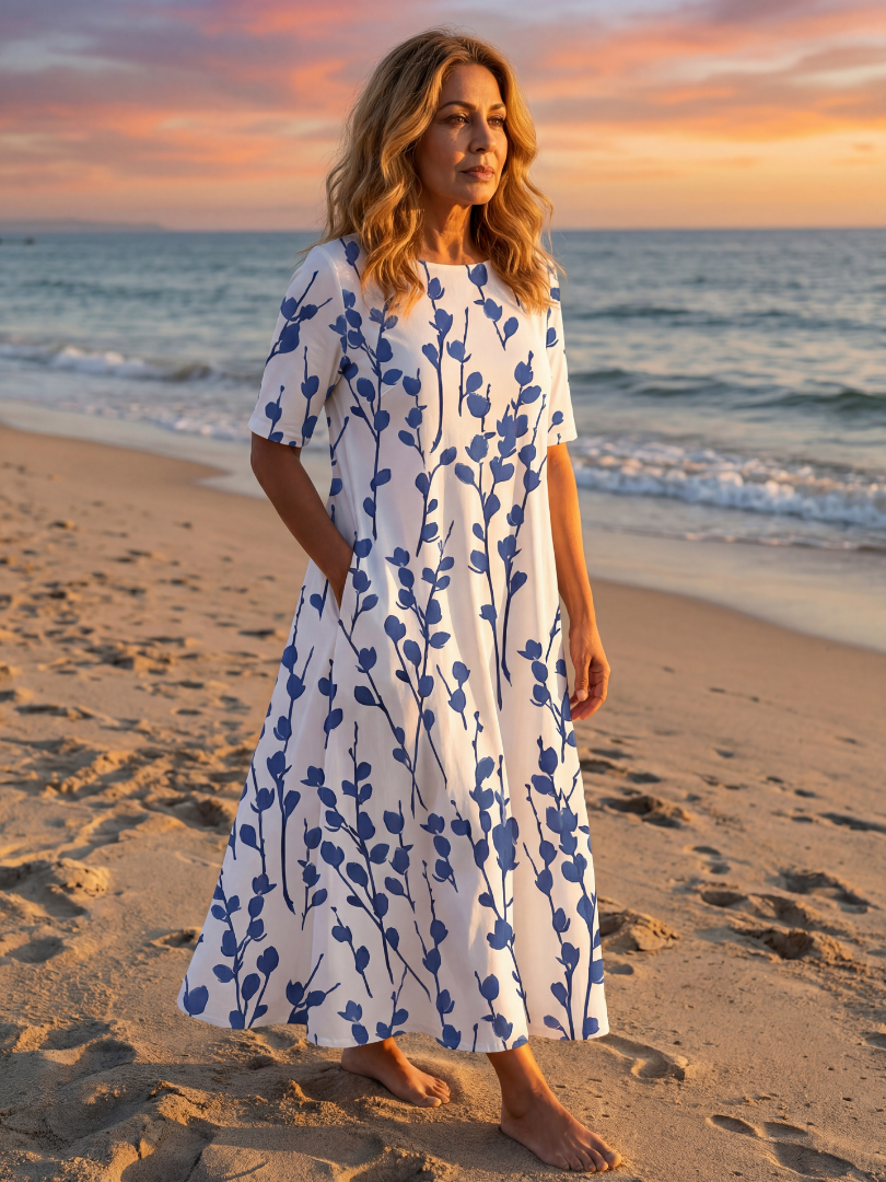 Women's chic floral midi dress with short sleeves & practical pockets, perfect for summer casual wear.
