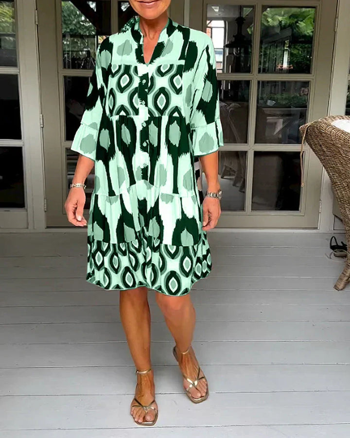 Boho-chic women's printed midi dress. Elegant flowy style, perfect for casual chic spring and summer fashion.