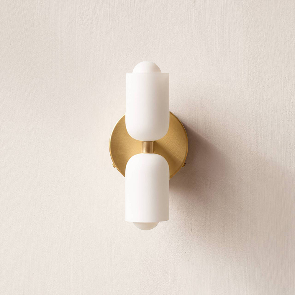 Modern uplight downlight wall lamp providing subtle ambient interior lighting.