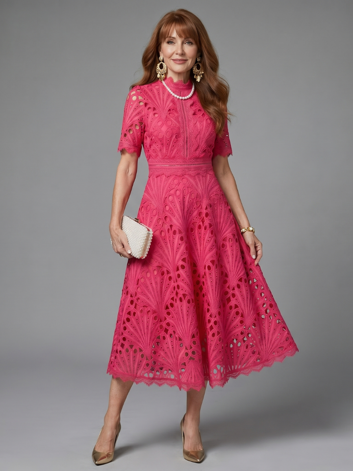 Elegant women's pink eyelet lace midi dress with defined waist & short sleeves, perfect for parties.