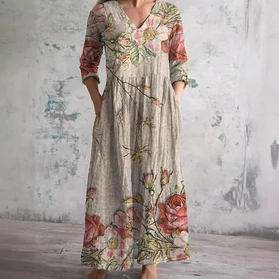 Women's elegant beige floral midi summer dress, flowing & comfortable for vacation or casual wear.