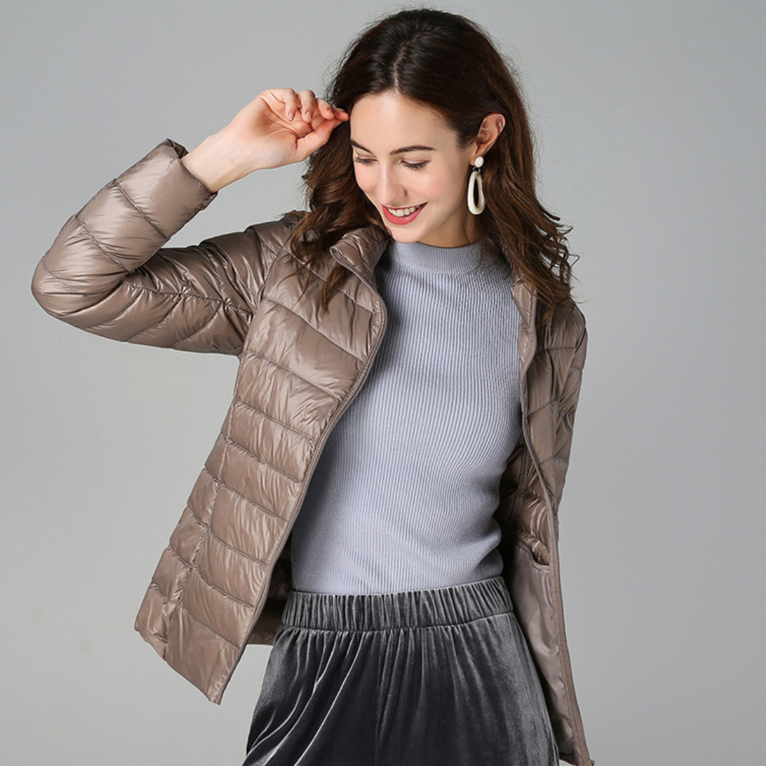 Stylish women's ultralight waterproof jacket, perfect for versatile everyday wear & outdoor adventures. All-weather.