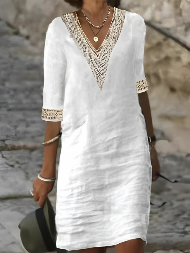 Woman wearing a flowy, chic casual dress. Perfect for everyday comfort and elegant summer style.