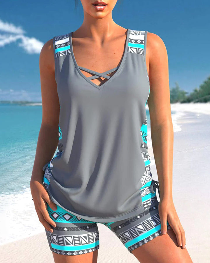 Stylish women's printed tankini with a secure criss-cross neck and draped swim top.