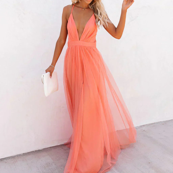 Elegant coral flowy maxi dress, ideal for wedding guests, cocktail parties, and sophisticated gatherings.