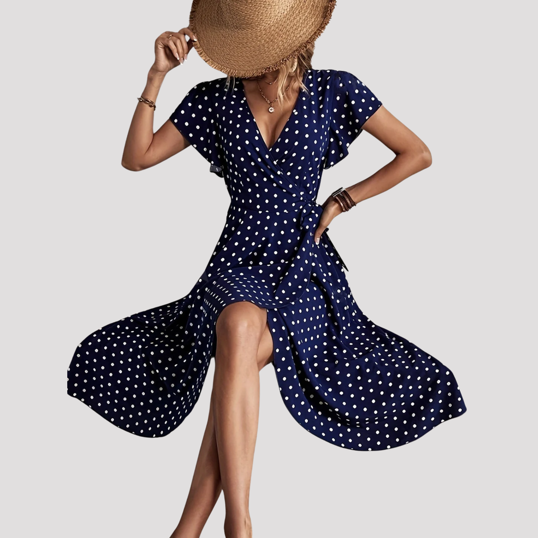 Women's elegant polka dot wrap midi dress with V-neck and flutter sleeves, perfect for summer casual or occasion wear.