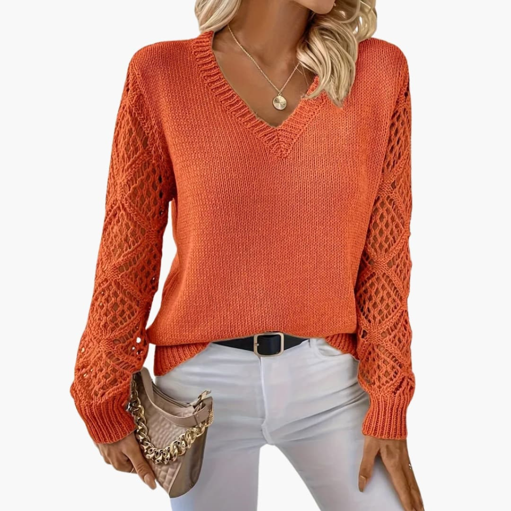 Comfortable women's V-neck long sleeve jumper, featuring an elegant knitted design and open sleeve detail.