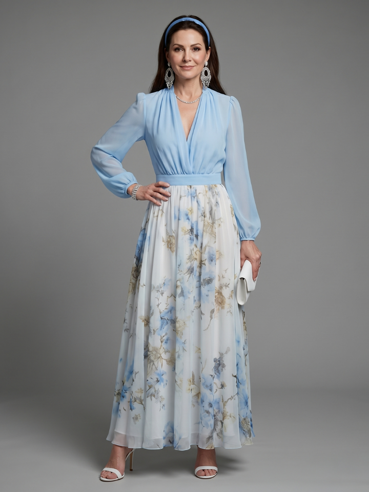 Elegant women's sky blue floral maxi dress with V-neck, sheer bodice, and flowing skirt, perfect for parties.