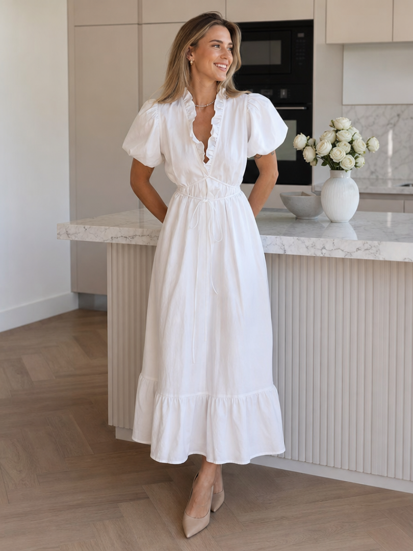 Women's white puff sleeve tie waist midi dress. Elegant summer occasion wear, feminine style.