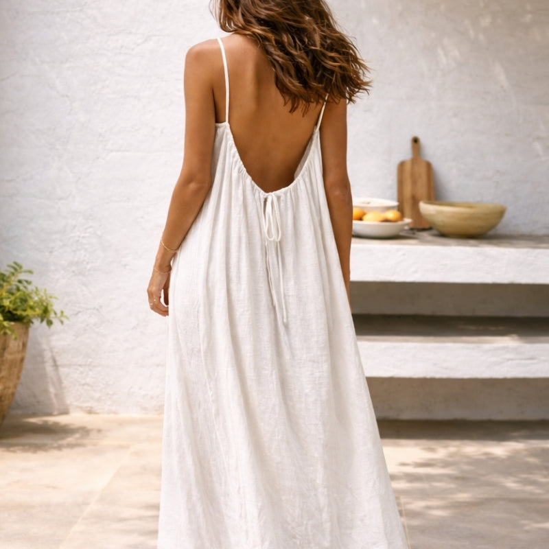 Full length women's summer maxi sundress with spaghetti straps, a must-have for vacation fashion.