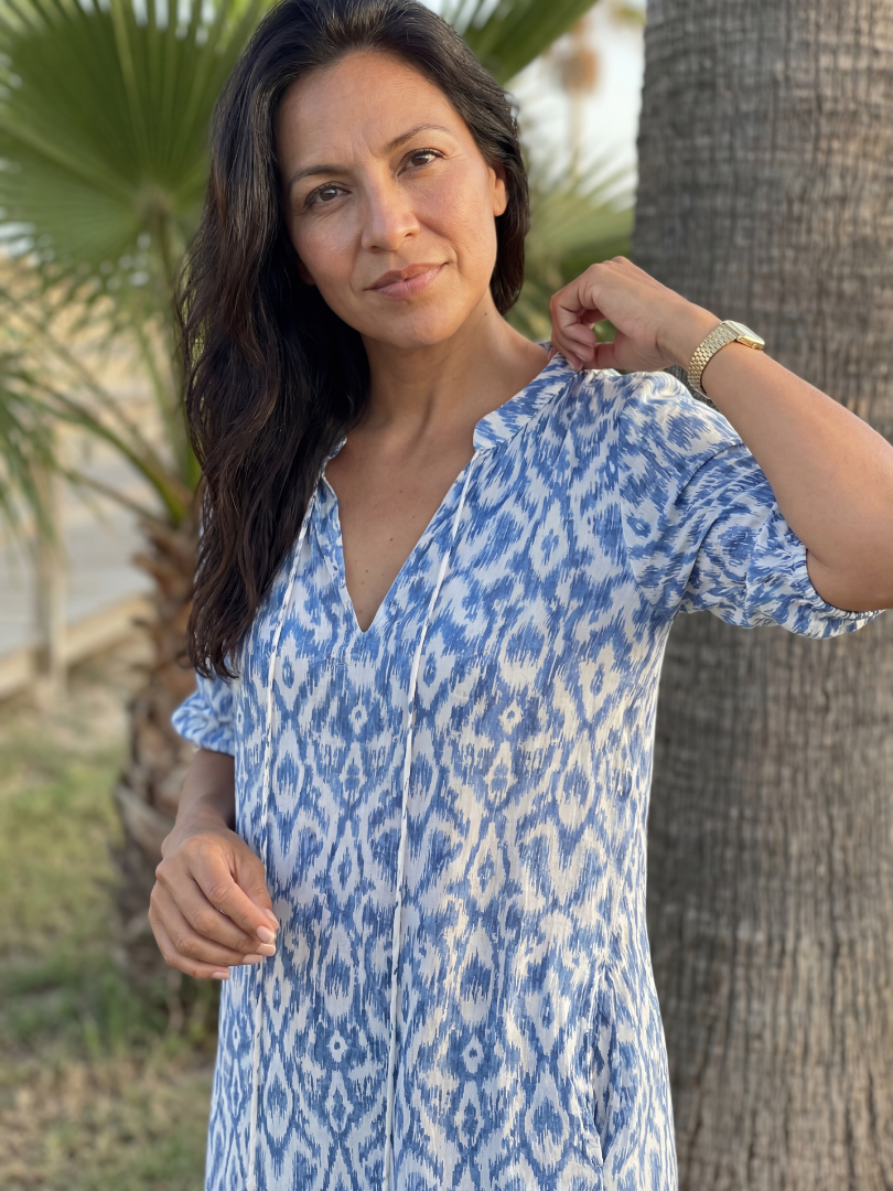 Women's coastal midi dress, geometric pattern. Relaxed fit, short sleeve V-neck, perfect for summer beach vacations.