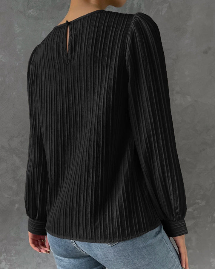 Women's round neck blouse in a soft fabric, designed for ultimate comfort and elegant appeal.