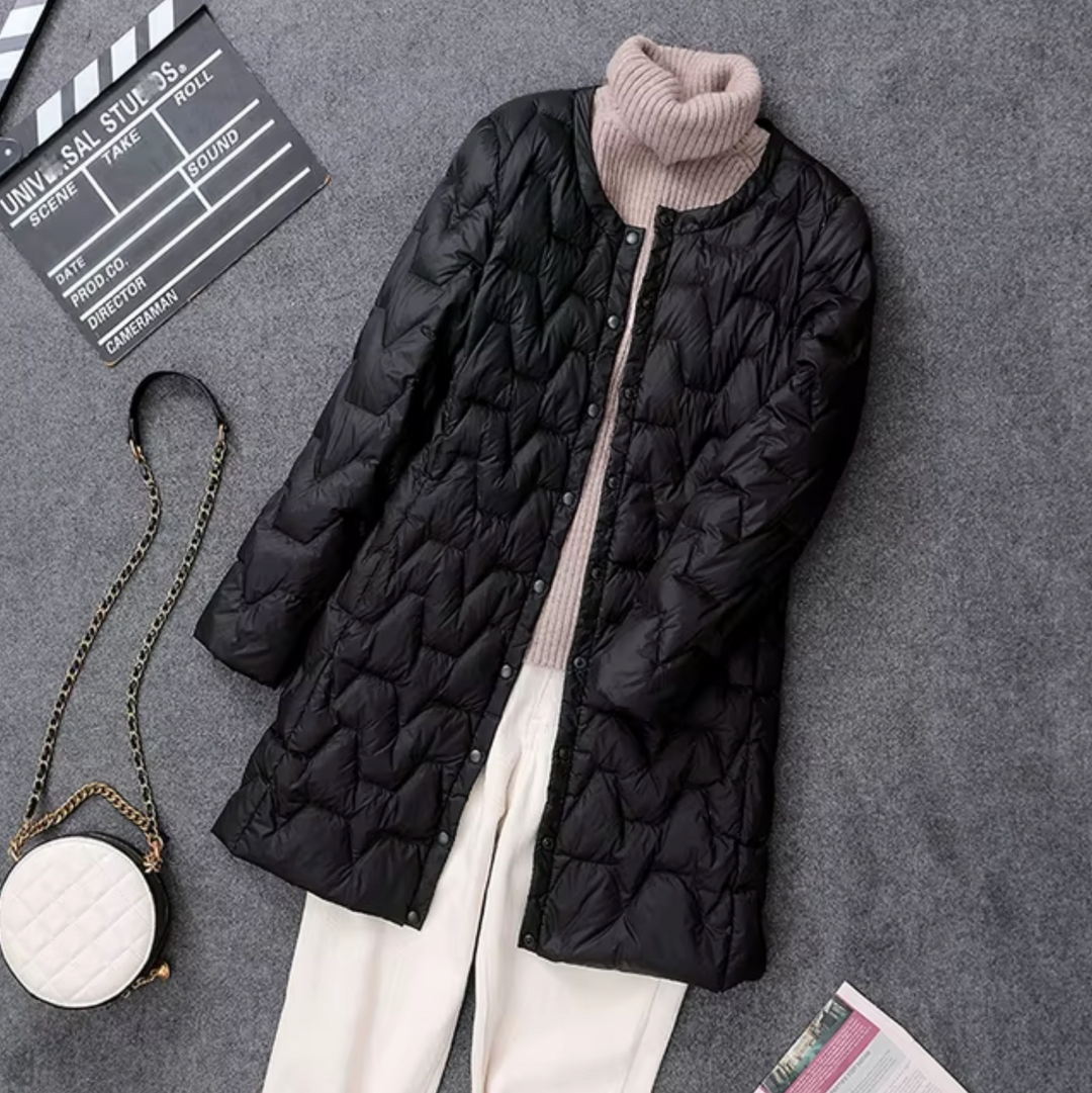 Elegant women's black puffer jacket. Stylish, warm winter outerwear for fashion-conscious women.