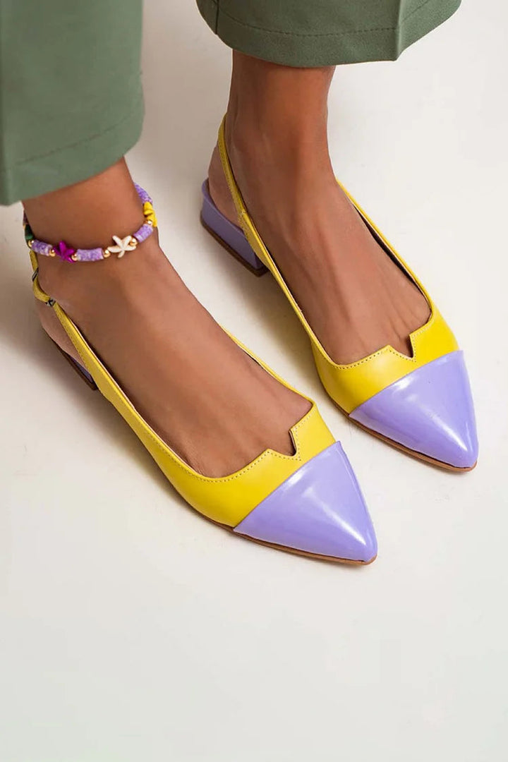 Fashionable women's pointed-toe flats with chic bi-color detail; versatile and comfortable for everyday wear.
