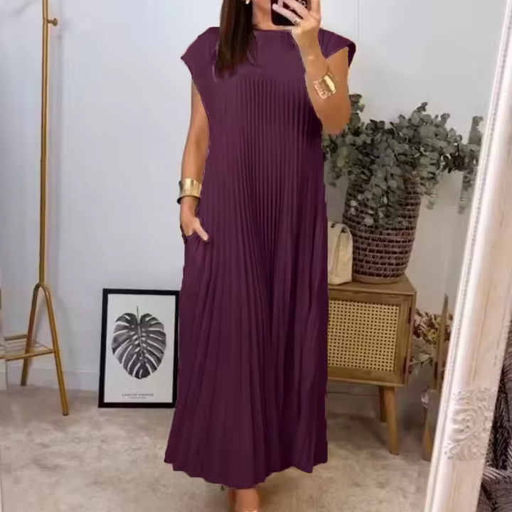 Women's chic pleated comfort dress. A timeless, versatile choice for summer and elegant wear.